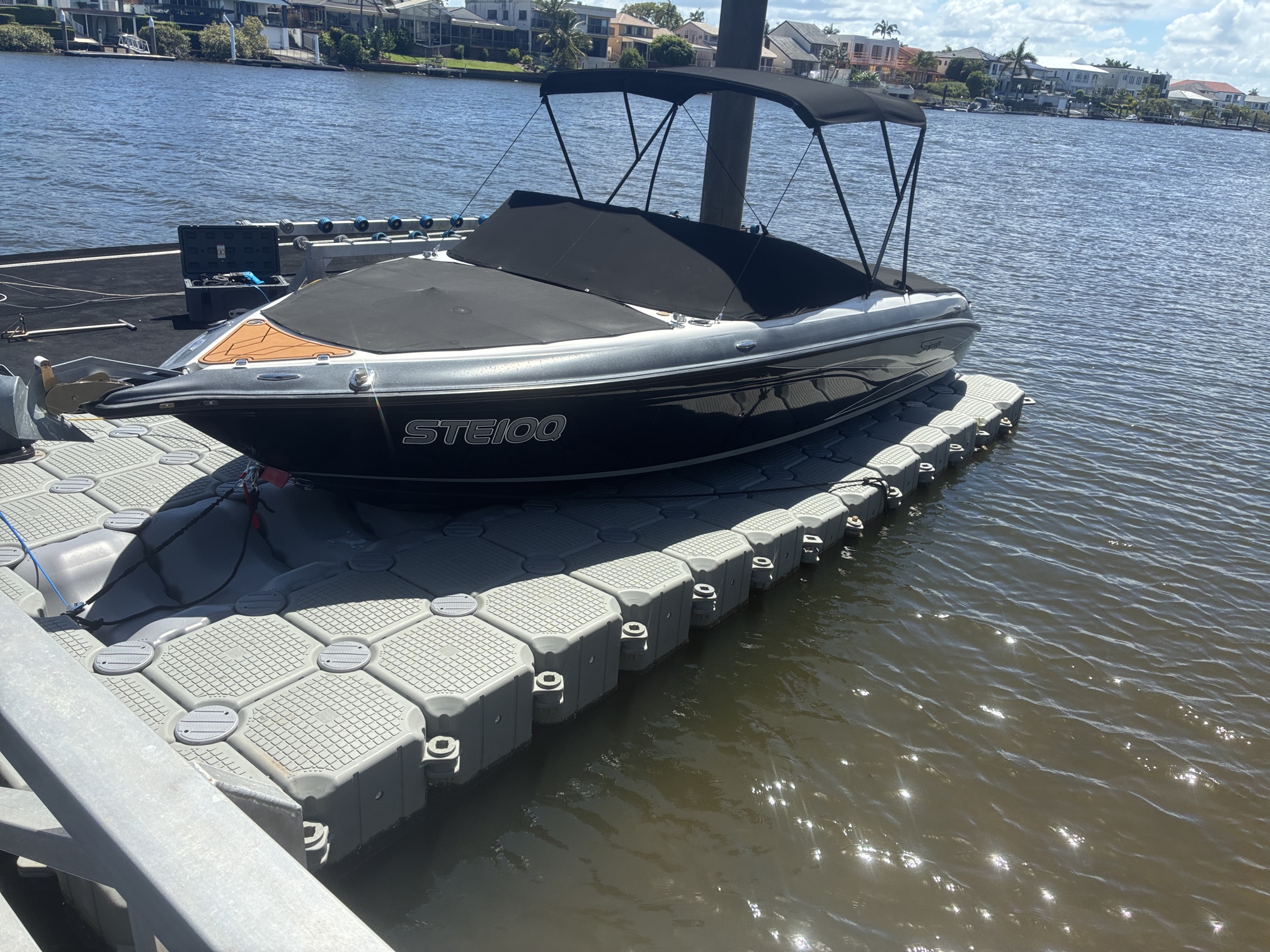 A Stejcraft boat on a FloatBricks dry dock
