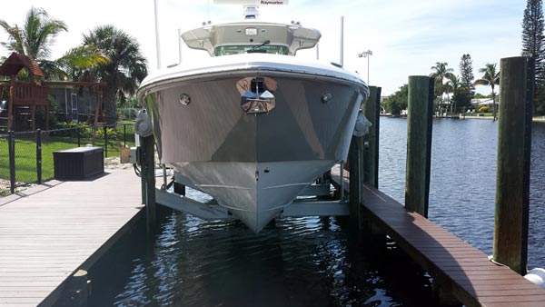 SeaPen vs Boat Lift: Which Dry Storage Solution is Right for You? 1 golden angled 4-post boat lift - DockPro